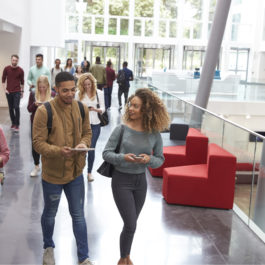 students walking through university building