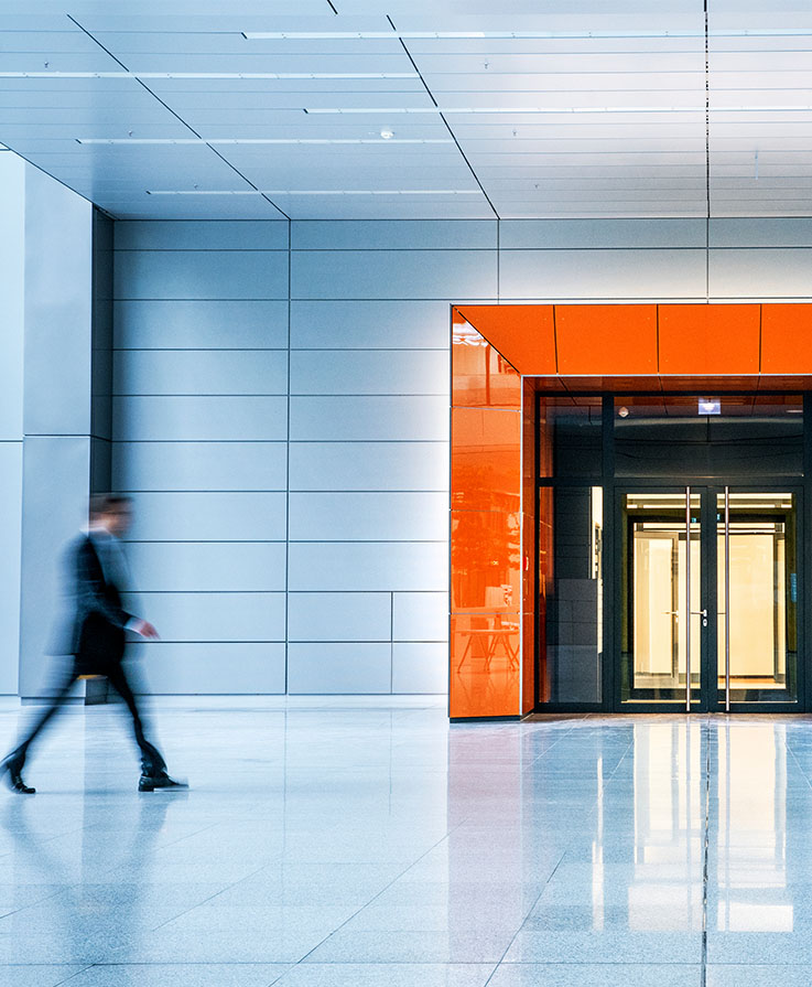 man walking through government building