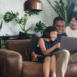 Family sitting on couch - Thumbnail Image