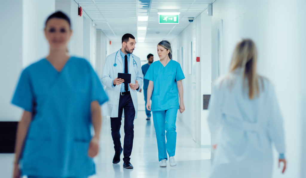 Doctor and Nurse at Hospital walking - Featured Image