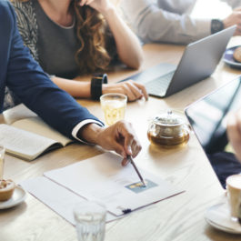 Group of people at table discussing work