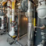 HTS Project Liuna Main 14 2024 HTS | Commercial & Industrial HVAC Systems, Parts, & Services Company Image of the Viessman Vitocrossal units showing the rear piping.